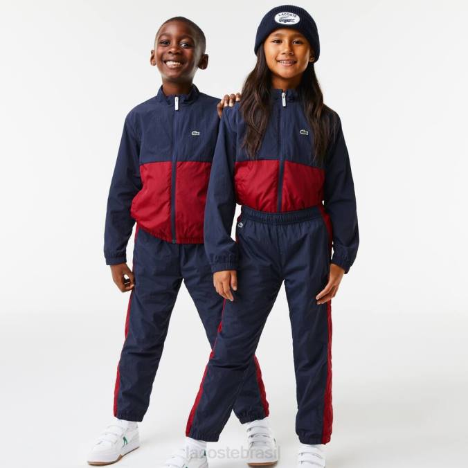 Lacoste crianças calças de treino com banda de contraste azul marinho/bordéu P2PX3225 roupas